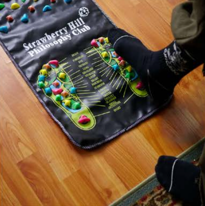 Snack Acupressure Foot Mat in use